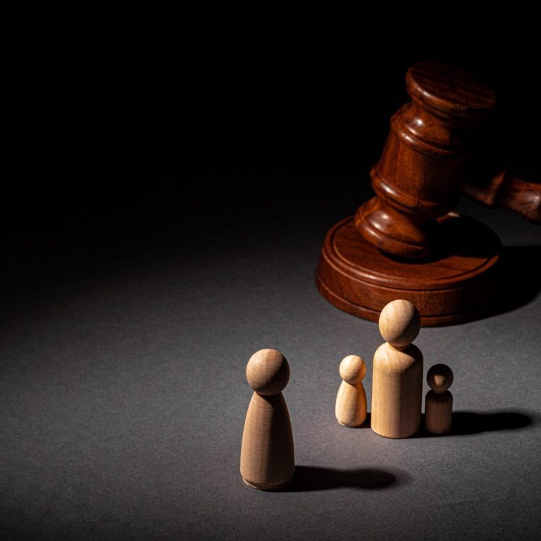 gavel-and-wooden-figures-symbolizing-family-separa-2026-03-23-23-48-51-utc.jpg